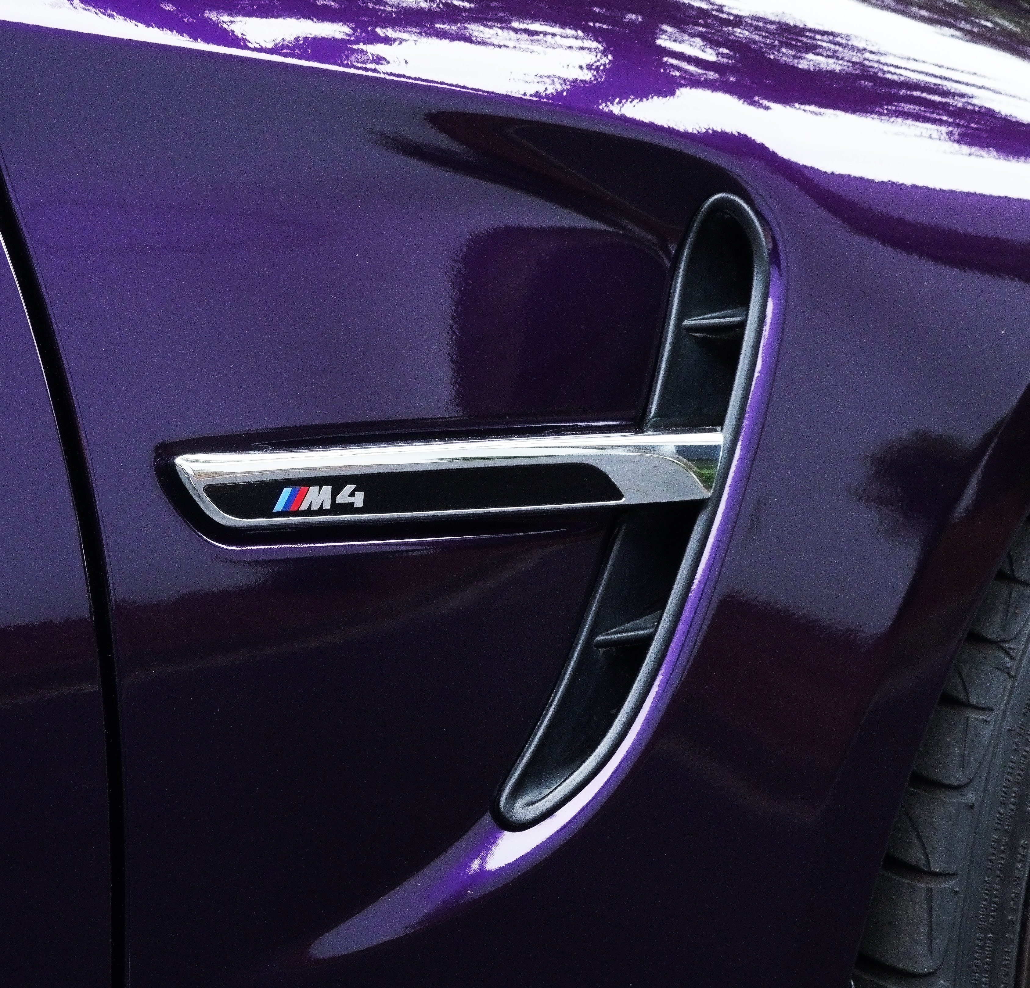 BMW M4 side vent and polished purple paint